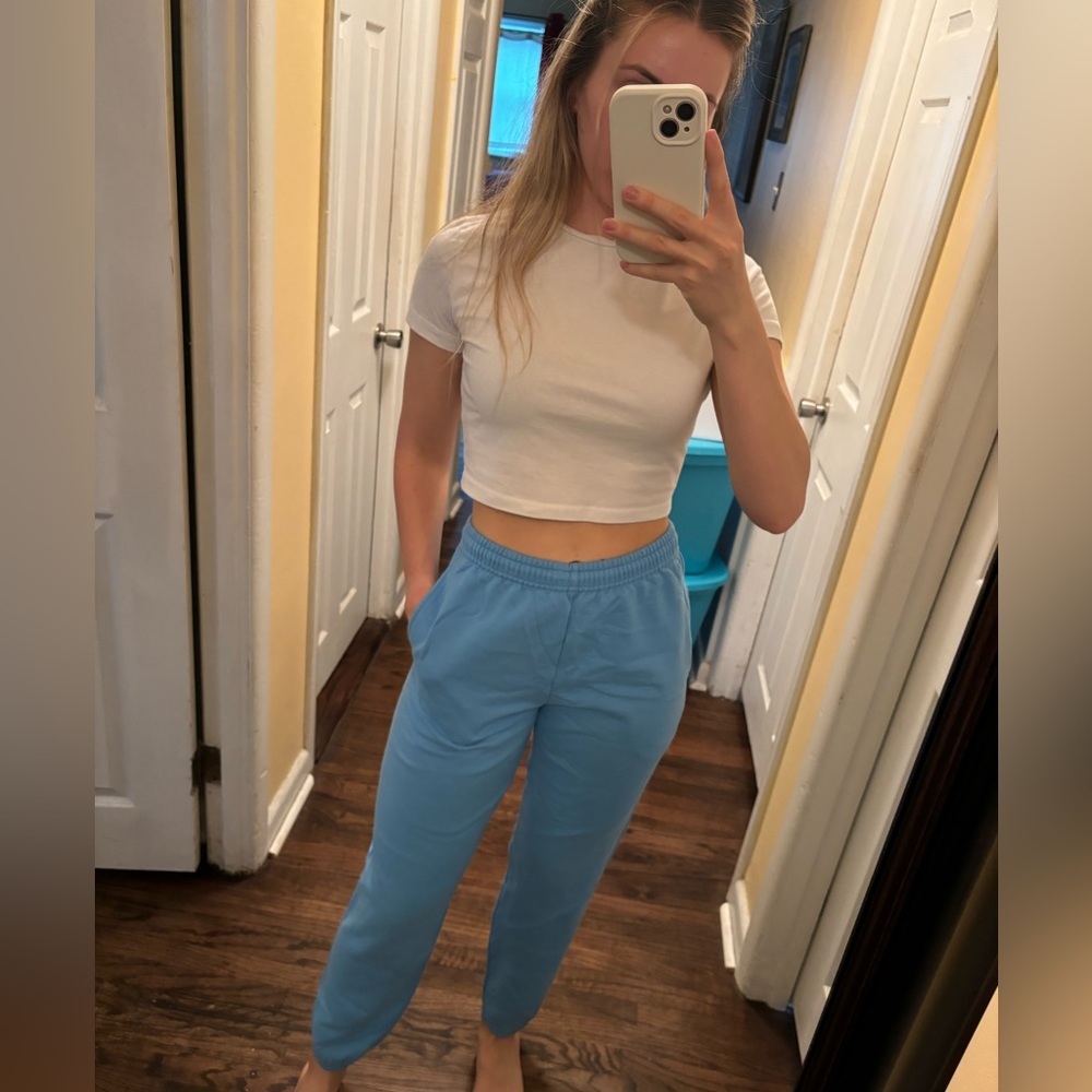 PAIR OF BLACK AND BLUE SWEATPANTS